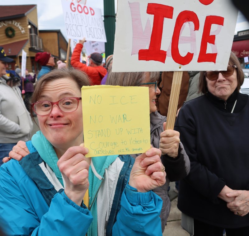 Young woman with homemade sign: No Ice No War